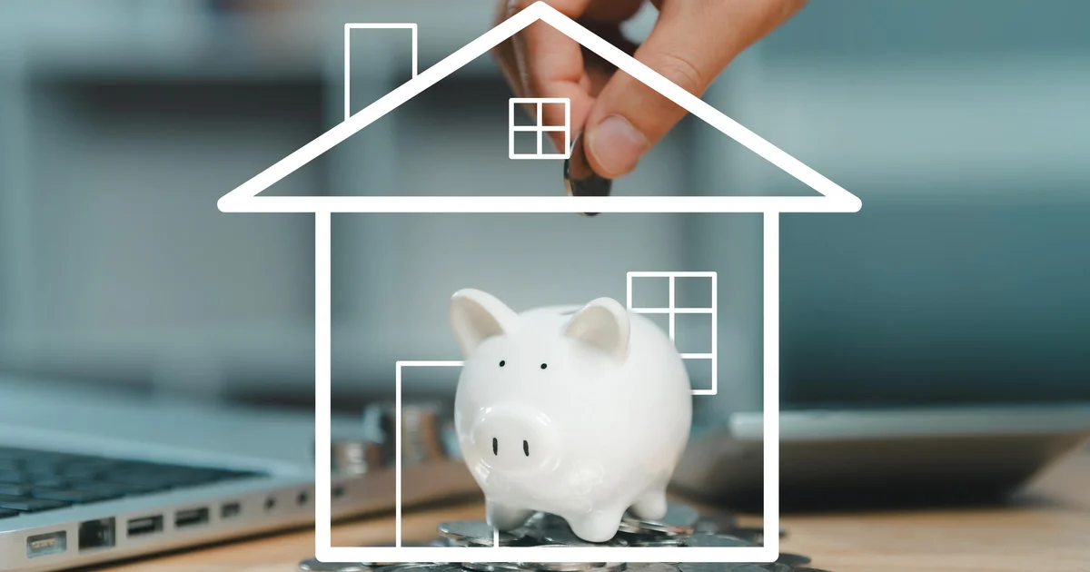 Hand placing a coin into a piggy bank, a conceptual image for Social Security payroll-tax revenue.